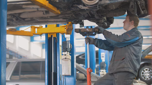 Mechanic conducting vehicle inspection